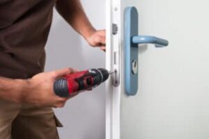carpenter-installing-a-door-lock