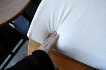 touching a white soft pillow