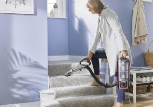 vacuuming-stairs-with-a-handheld