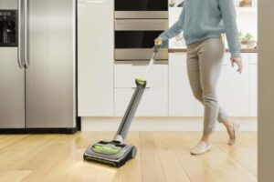 vacuuming-the-kitchen-floor