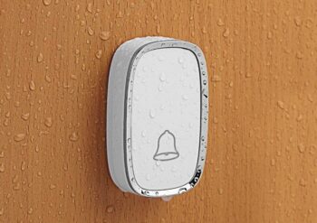 wet white buzzer on wooden door