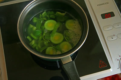 making-delicious-soup-using-a-silver-saucepan