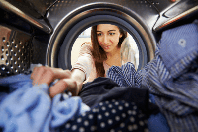 a woman reaching for her laundry