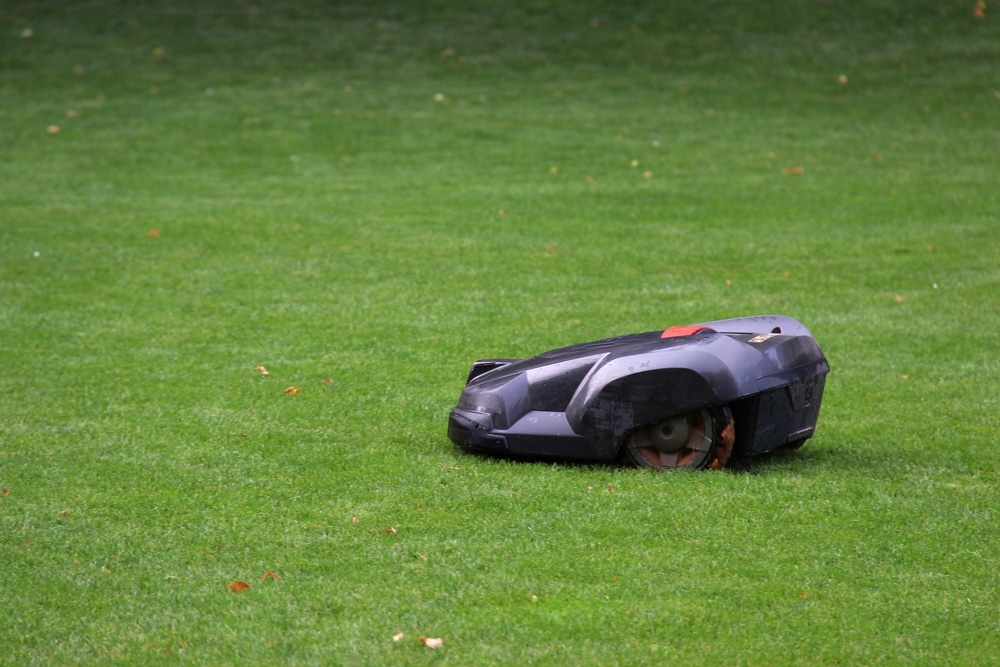 How does a robot lawn mower work